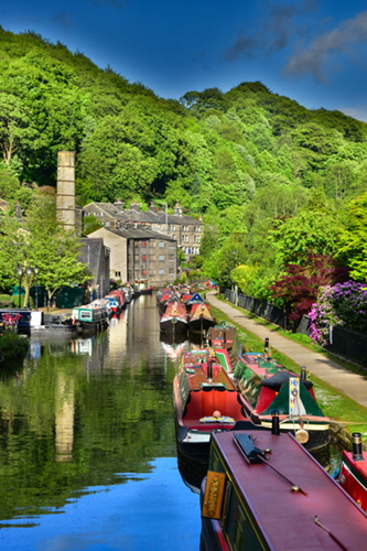 Historic Narrowboats line the Rochdale Canal by The Smithery